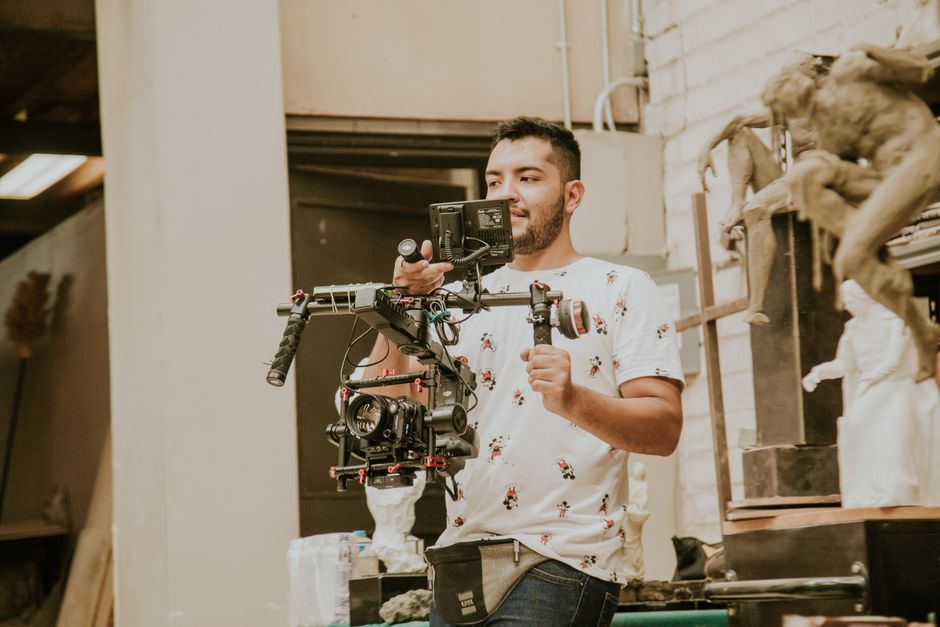 Wedding videographer filming a couple